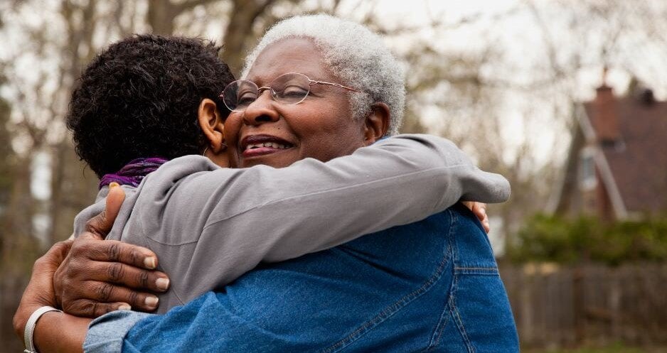 Black Grandma Grandson Hug Outdoors_Ron Levine-GettyImages-123167791+5100x3499-1