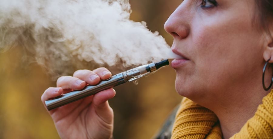 LatinxWomanSmokingCigarette_Dariusz Makowski-Getty Images_1196039322_7952x5304
